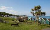 The large, sloped green with children's playground area behind the sea front in Gurnard. - Thumbnail Image