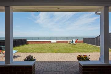 The terrace just outside the main bedroom is the perfect spot to sit and take in the sea air.