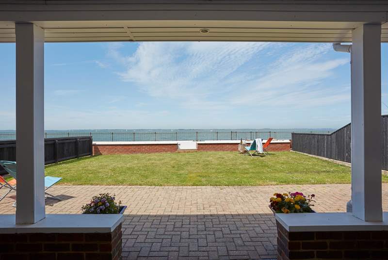 The terrace just outside the main bedroom is the perfect spot to sit and take in the sea air.