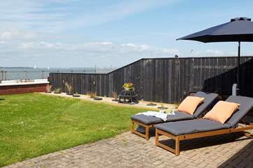 Sunshine or shade under the umbrella enjoy the view with a good read.