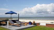 A peaceful beach area can be found at the bottom of the garden, follow the path to the left for your morning dip.