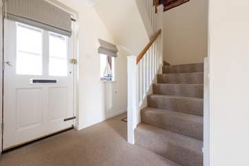 Stairs lead to the bedrooms.