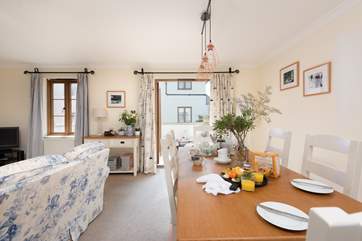 The open plan living-room has access to the sunny balcony.