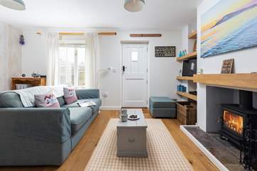 The characterful sitting-area is cosy throughout the year thanks to the wood-burner.