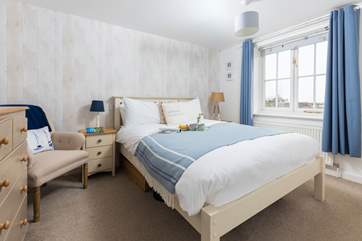 Pretty bedroom 1 has a comfy king-size bed.