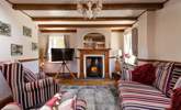 The cute sitting-room, you can light the wood-burner for cosy evenings. - Thumbnail Image