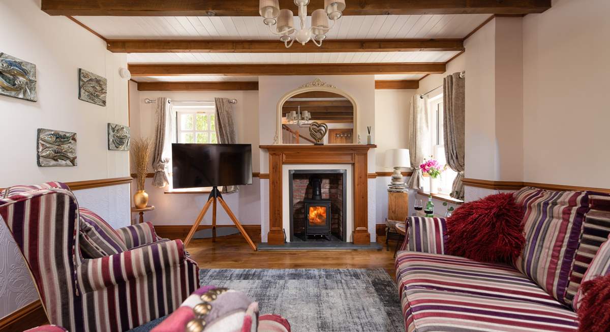 The cute sitting-room, you can light the wood-burner for cosy evenings.