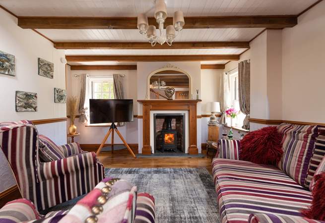 The cute sitting-room, you can light the wood-burner for cosy evenings.