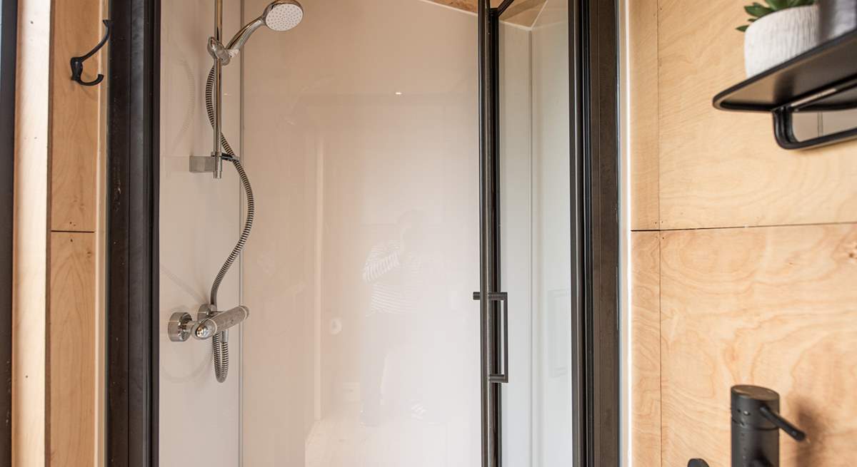 The stylish shower-room is perfect for freshening up in after a day of adventures. 