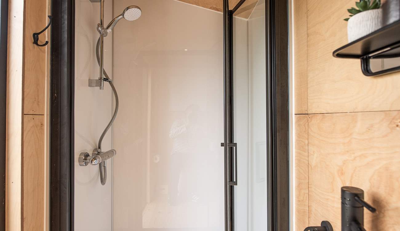 The stylish shower-room is perfect for freshening up in after a day of adventures. 