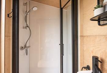 The stylish shower-room is perfect for freshening up in after a day of adventures. 