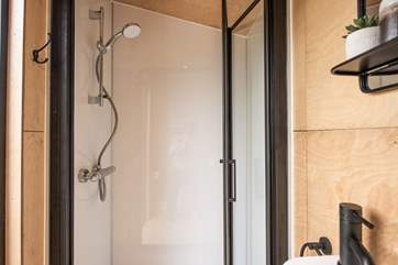 The stylish shower-room is perfect for freshening up in after a day of adventures.