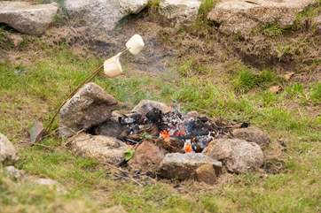 It wouldn't be a glamping trip without toasting marshmallows over the fire-pit.