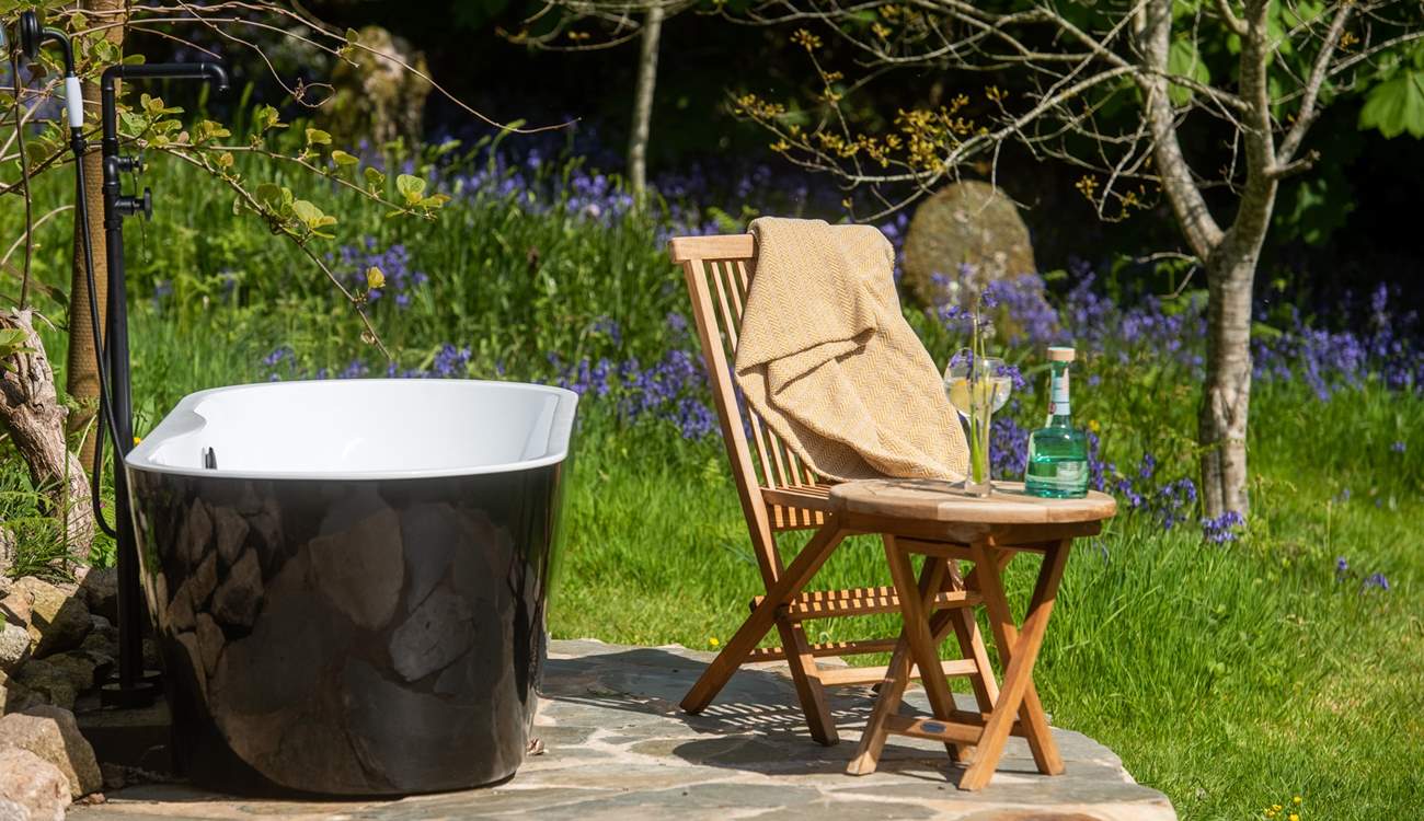 The outdoor bath is the most heavenly addition to this hidden haven. Al fresco bathing never looked so good