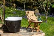 The outdoor bath is the most heavenly addition to this hidden haven. Al fresco bathing never looked so good