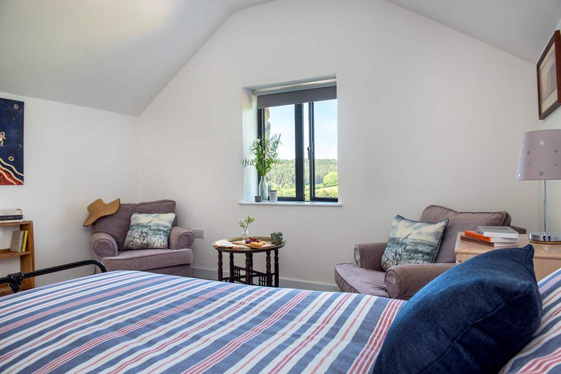 The rooms two armchairs are great places to relax.