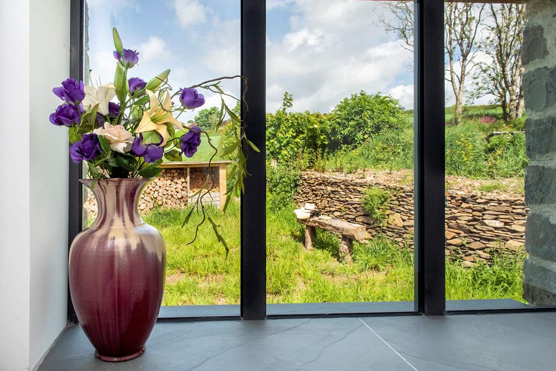 Crisp natural light floods in from the many windows dotted around the house.