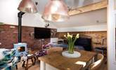 The open plan living space has vaulted ceilings making the cabin light and bright. - Thumbnail Image