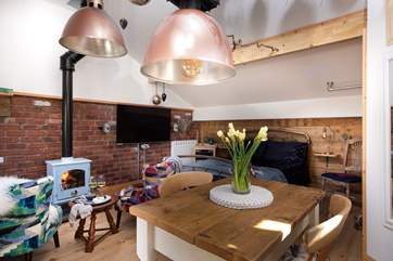 The open plan living space has vaulted ceilings making the cabin light and bright.