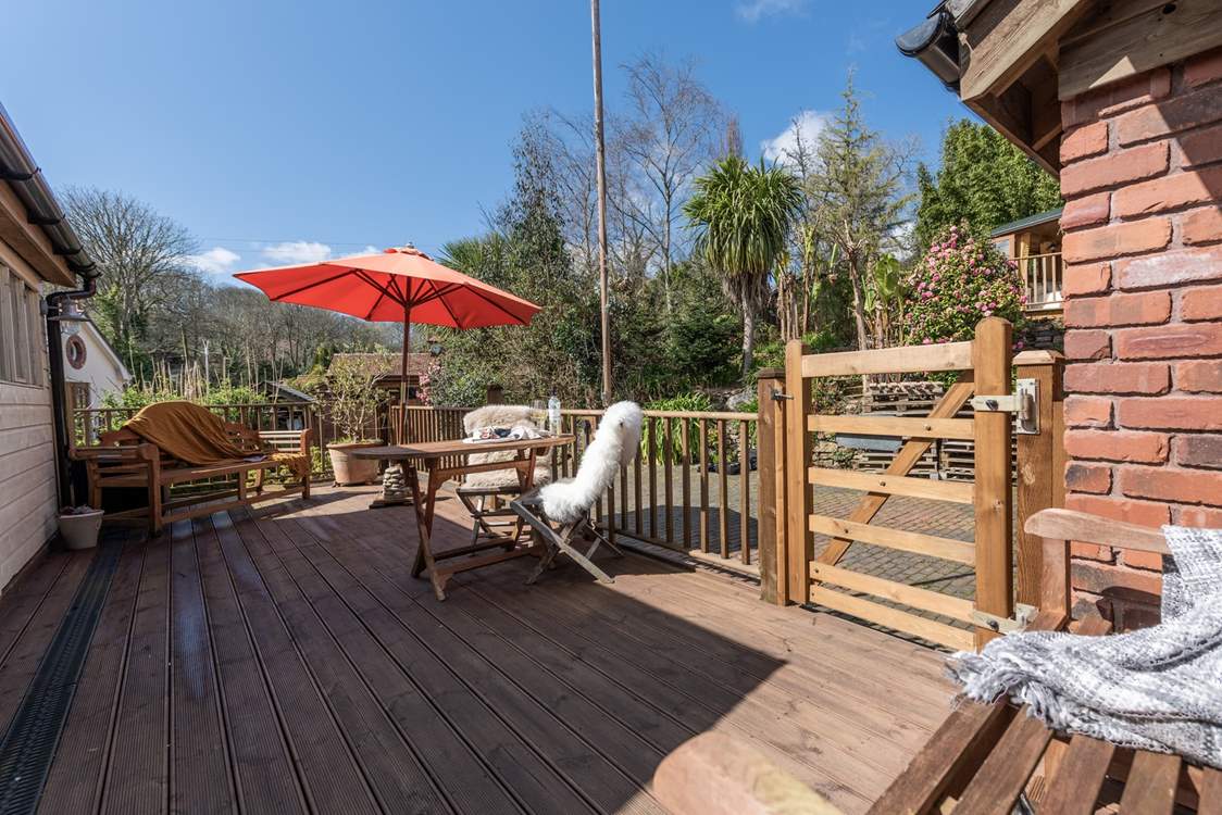 The deck is a gorgeous place to relax.