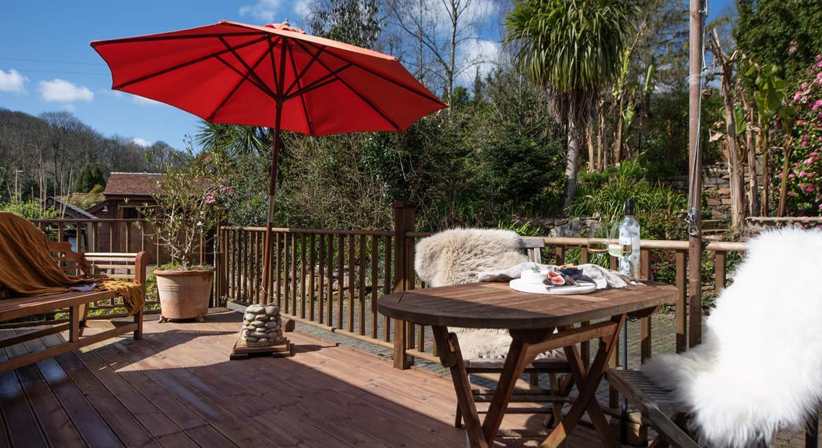 The beautiful deck is surrounded in sub-tropical paradise.