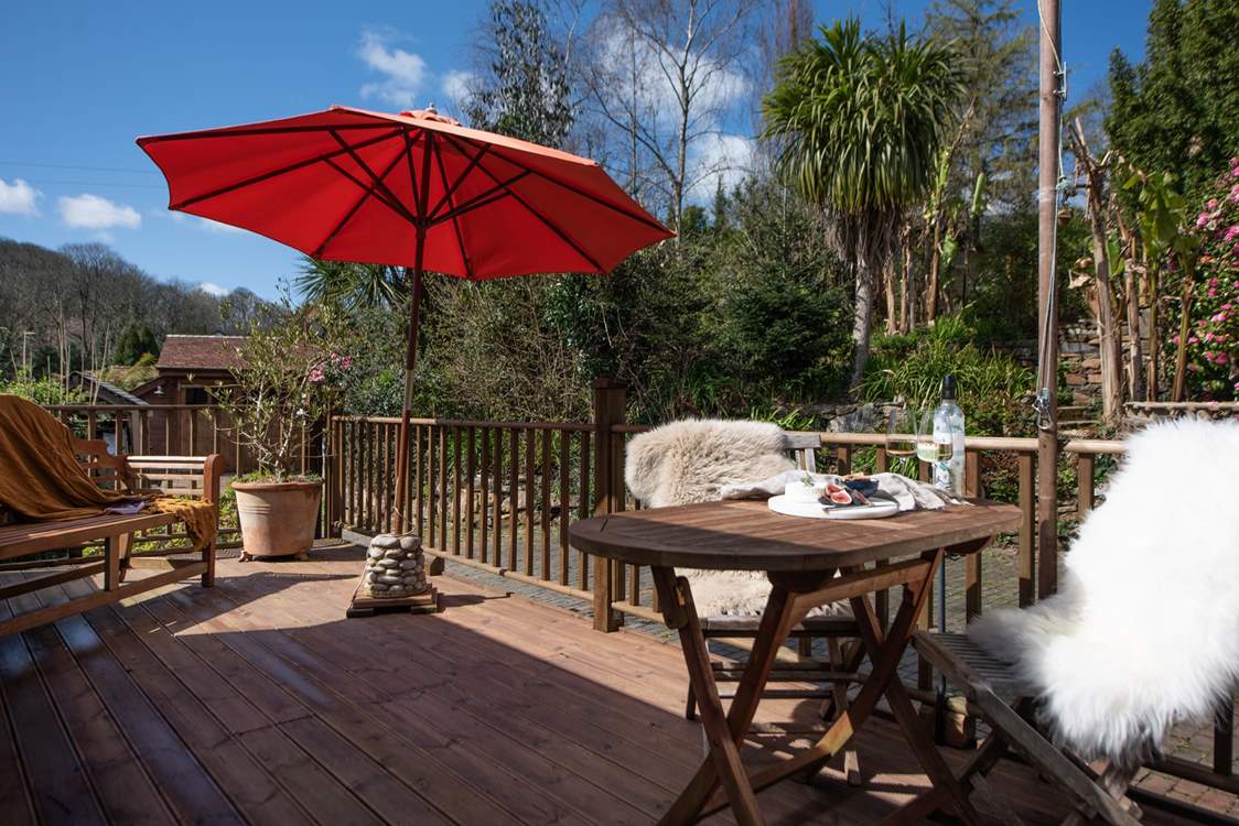 The beautiful deck is surrounded in sub-tropical paradise.