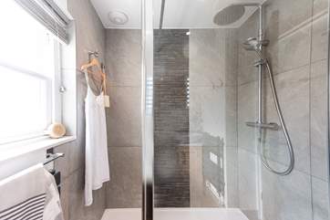The stylish shower-room is on the ground floor