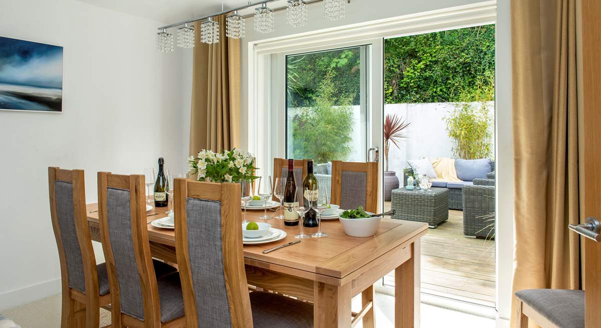 Sliding doors lead from the dining area out onto the terrace.