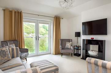 The double doors ensure you enjoy the view whilst relaxing in the sitting-area.