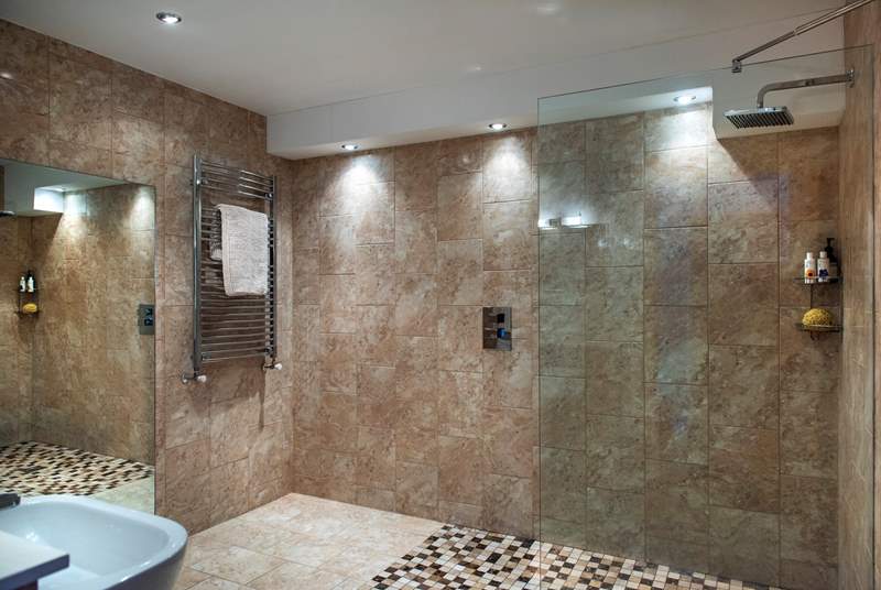 On the ground floor is the wet-room, it's huge and perfect for rinsing off when you come in from the beach.