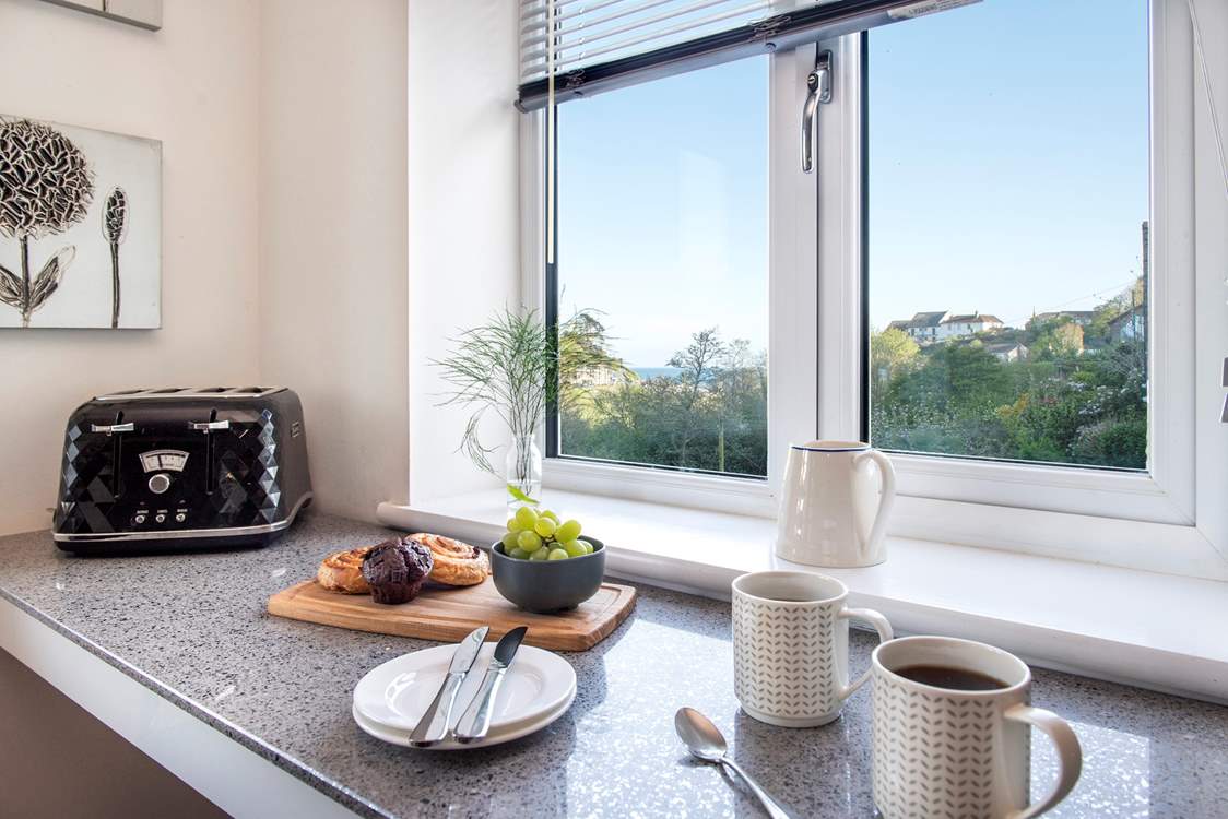 Take a pew at the little breakfast-bar and enjoy the view across the village to the beach.