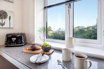 Take a pew at the little breakfast-bar and enjoy the view.