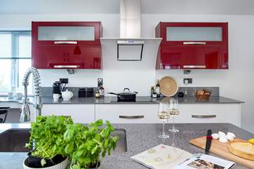 The kitchen has a brilliant vibrant design.