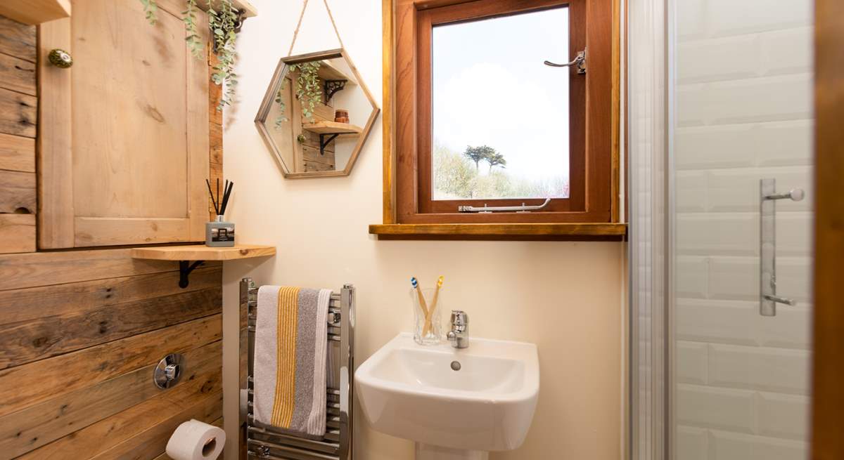 The delightful bathroom is filled with natural light.