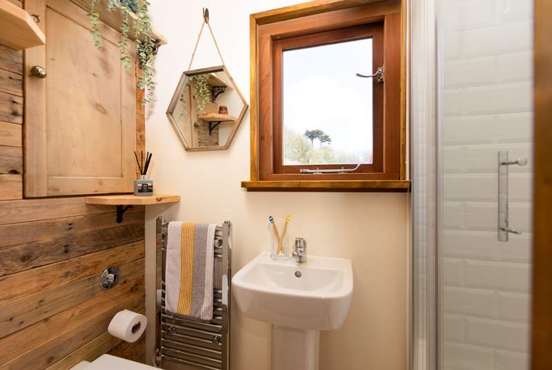 The delightful bathroom is filled with natural light.