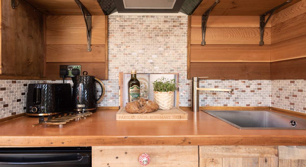 The sturdy wooden worktop is perfect for preparing delicious meals.