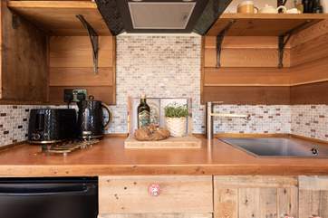 The sturdy wooden worktop is perfect for preparing delicious meals.