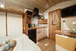 A compact kitchen can be found at the rear of the hut and has everything you will need.