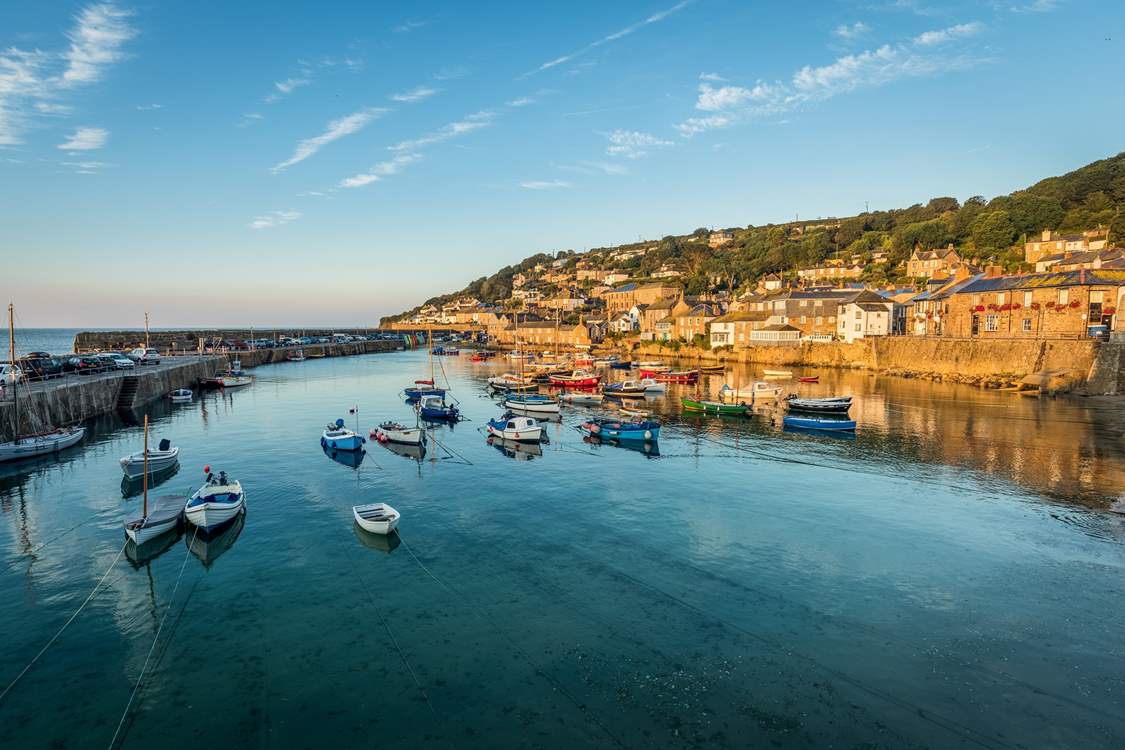 The picturesque fishing village of Mousehole is only a short drive away.