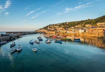 The picturesque fishing village of Mousehole is only a short drive away.