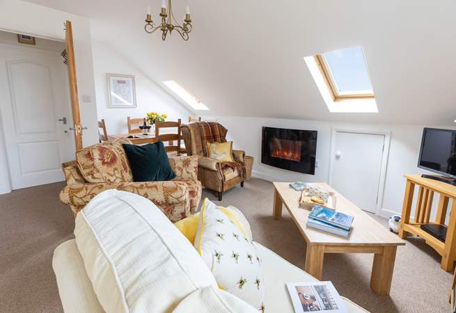 The cosy living space with glimpses of Dartmoor through the Velux windows. Please mind your head on the sloping ceiling. 