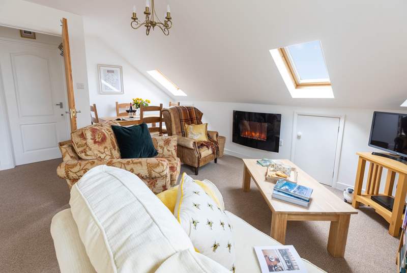 The cosy living space with glimpses of Dartmoor through the Velux windows. Please mind your head on the sloping ceiling. 