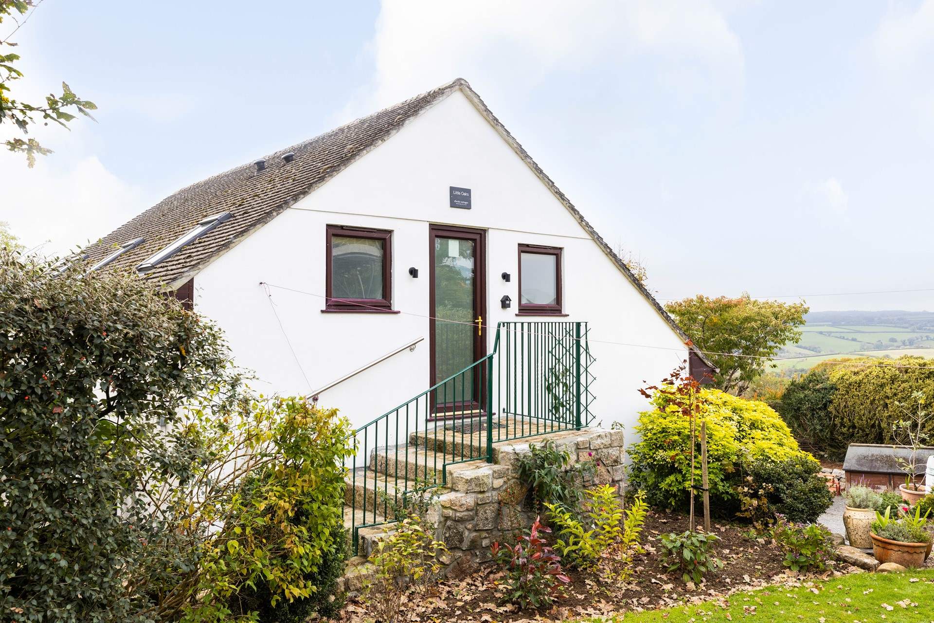 Welcome to Little Oaks climb the steps to your front door.