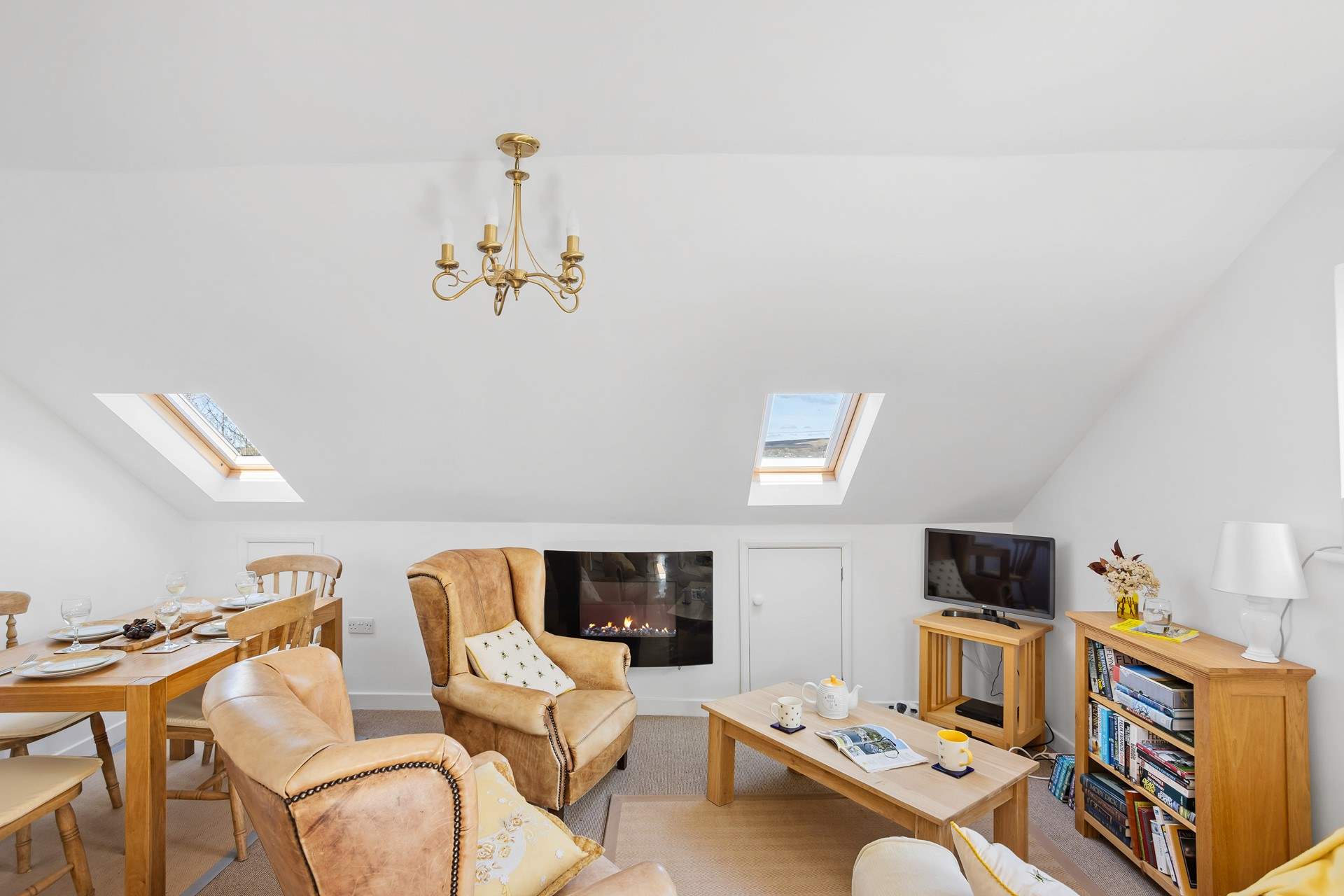 The cosy living space with glimpses of Dartmoor through the Velux windows. Please mind your head on the sloping ceiling. 