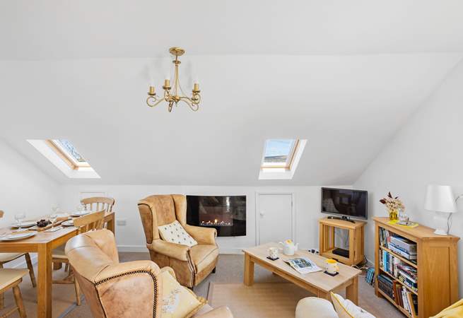 The cosy living space with glimpses of Dartmoor through the Velux windows. Please mind your head on the sloping ceiling. 