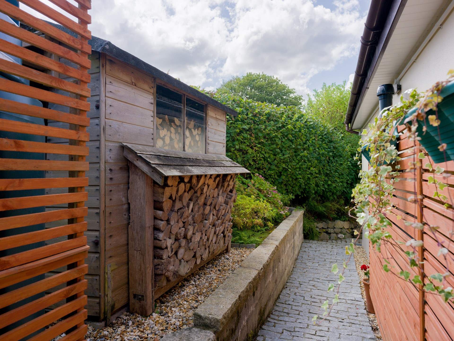 Follow your path down to the decking area passing your dedicated parking spot.