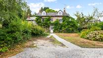 What a beautiful home, with plenty of parking in your enclosed driveway.