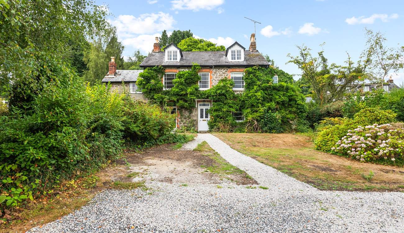 What a beautiful home, with plenty of parking in your enclosed driveway.