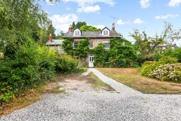 What a beautiful home, with plenty of parking in your enclosed driveway.