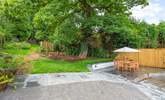 Oodles of space in the garden and terrace area. Please be aware of the steps and small stream which runs through the paved area (which is covered by a grate for safety). - Thumbnail Image